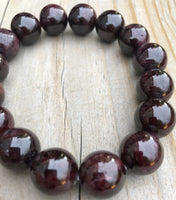 
              14mm Garnet Gemstone Bracelet
            