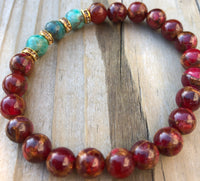 
              Red Suspended Copper Agate & African Howlite Gemstone Bracelet
            